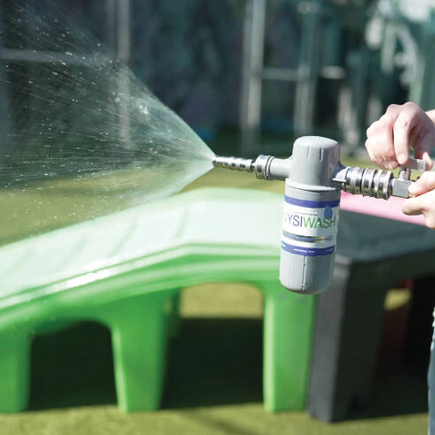 Wysiwash® Sanitizing System,"Hose sprayer attachment spraying a wide stream of water"
