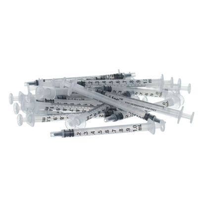 Small Syringes without Needles,"Pile of clear syringes without needles"