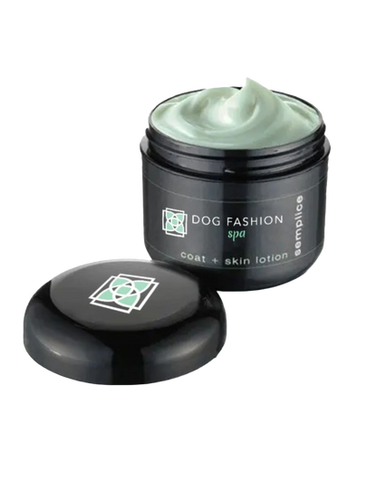 Semplice Leave-in Lotion,"Open black jar with pale green lotion and lid beside it"