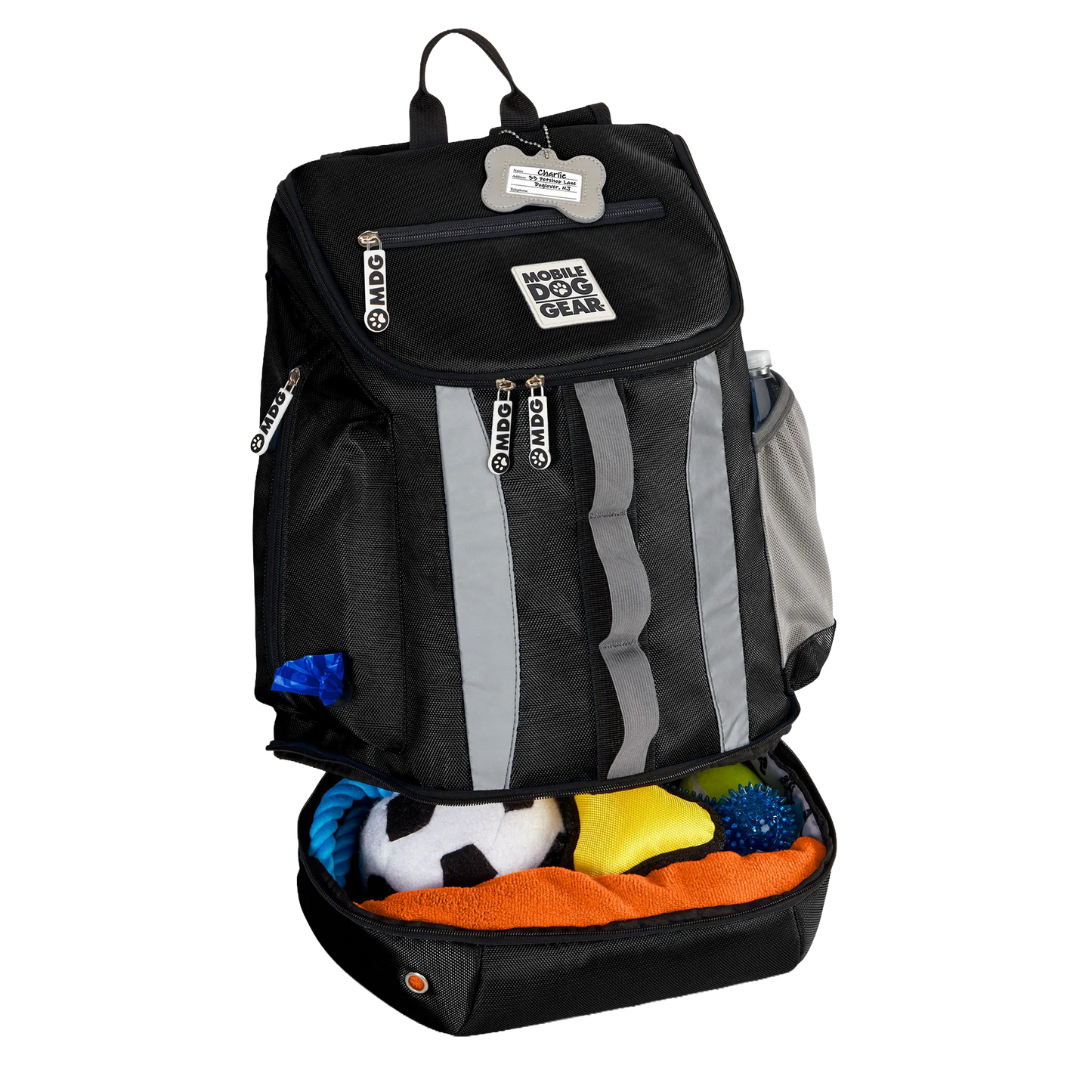 Drop Bottom Week Away Backpack,"Black backpack with open bottom compartment filled with dog toys"