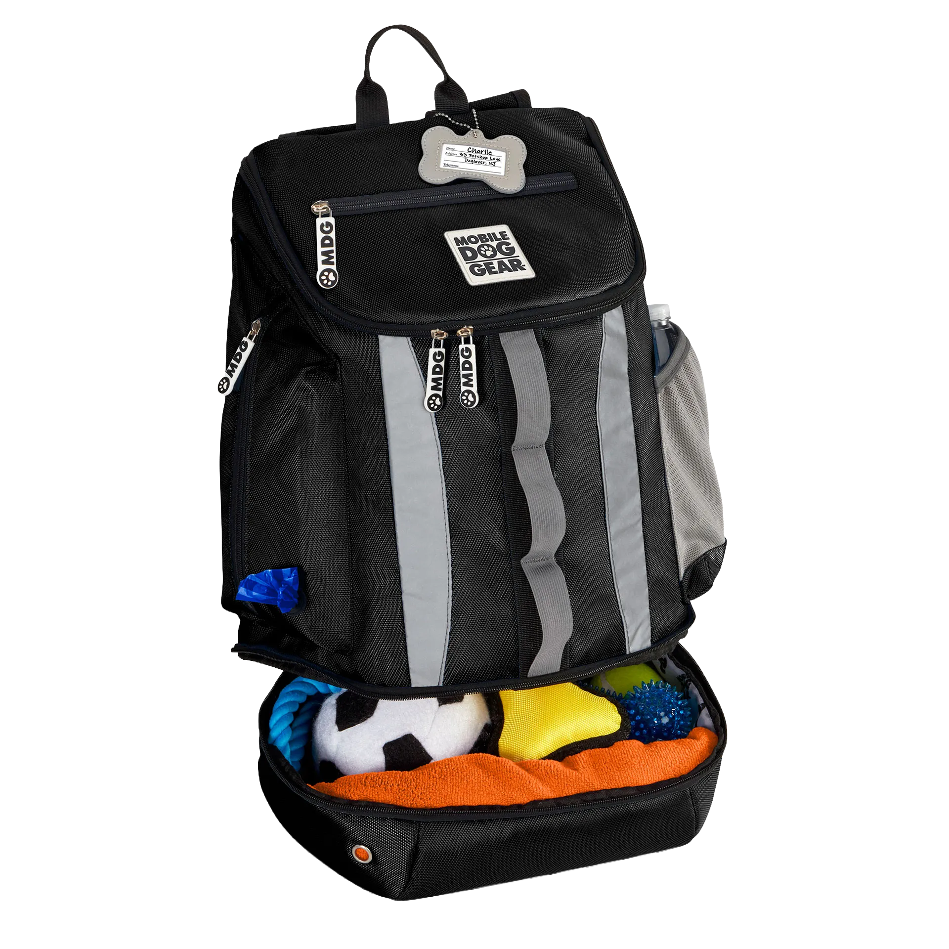 Drop Bottom Week Away Backpack,"Black backpack with open bottom compartment filled with dog toys"
