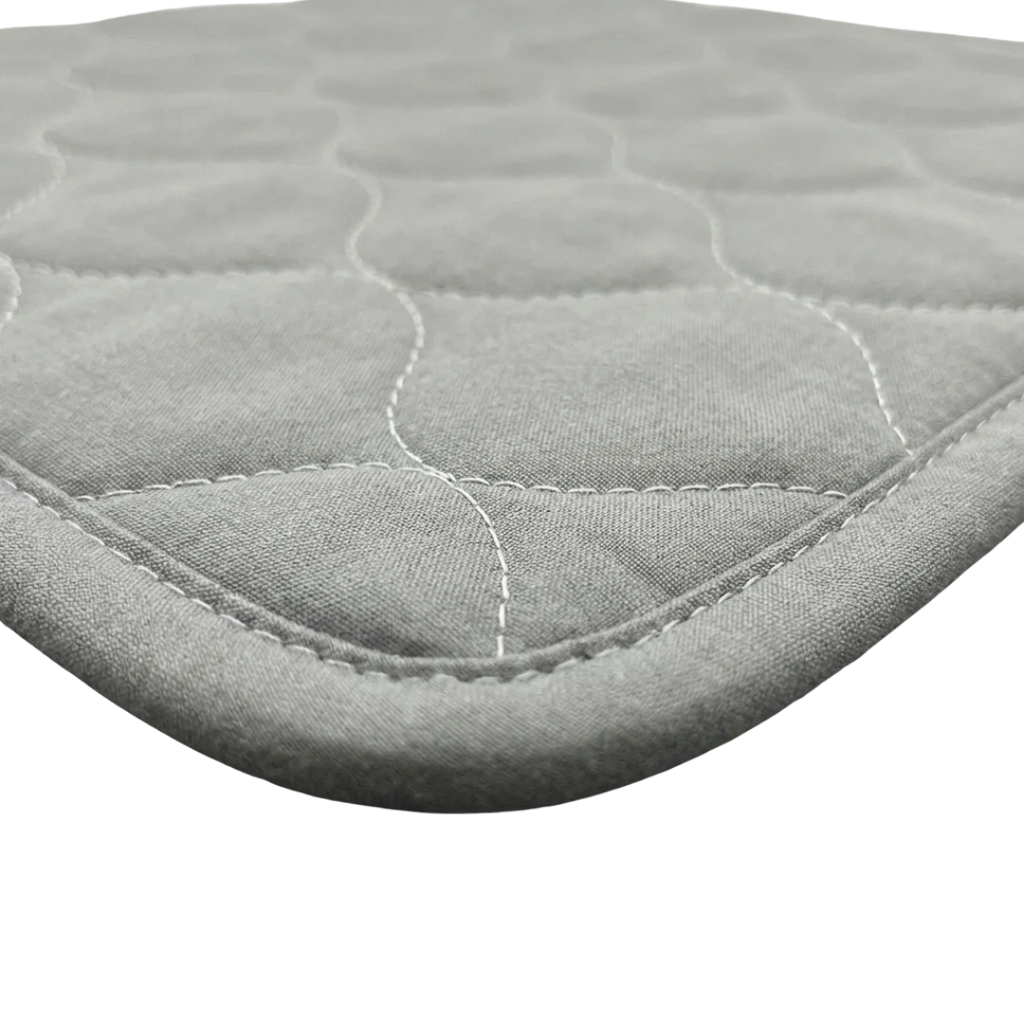 Puppywarmer Incubator Pee Pad,"Quilted oval fabric pad with stitched edge"