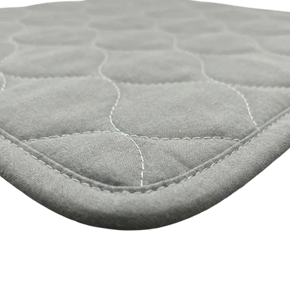 Puppywarmer Incubator Pee Pad,"Quilted oval fabric pad with stitched edge"