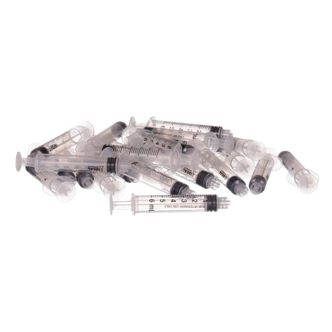 Small Syringes without Needles,"Pile of clear plastic syringes without needles"