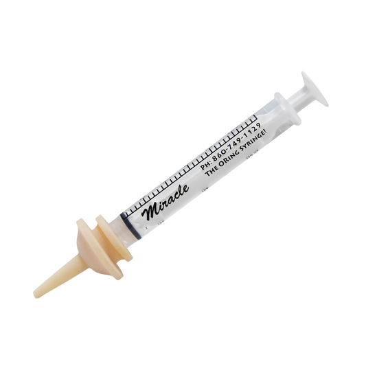The Miracle Nipple® for Kittens, Puppies, and Small Mammals,"Clear feeding syringe with beige nipple attachment"