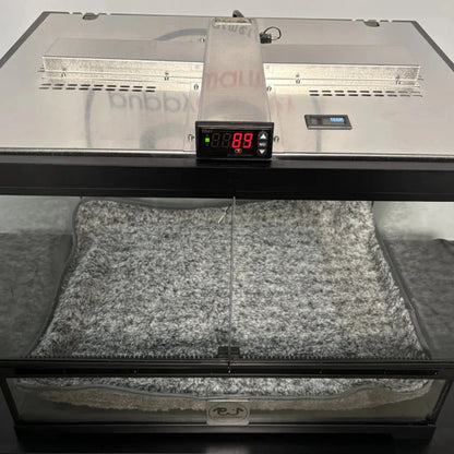 Puppywarmer® Puppy Incubator,"Glass-front incubator with digital temperature display and gray bed"