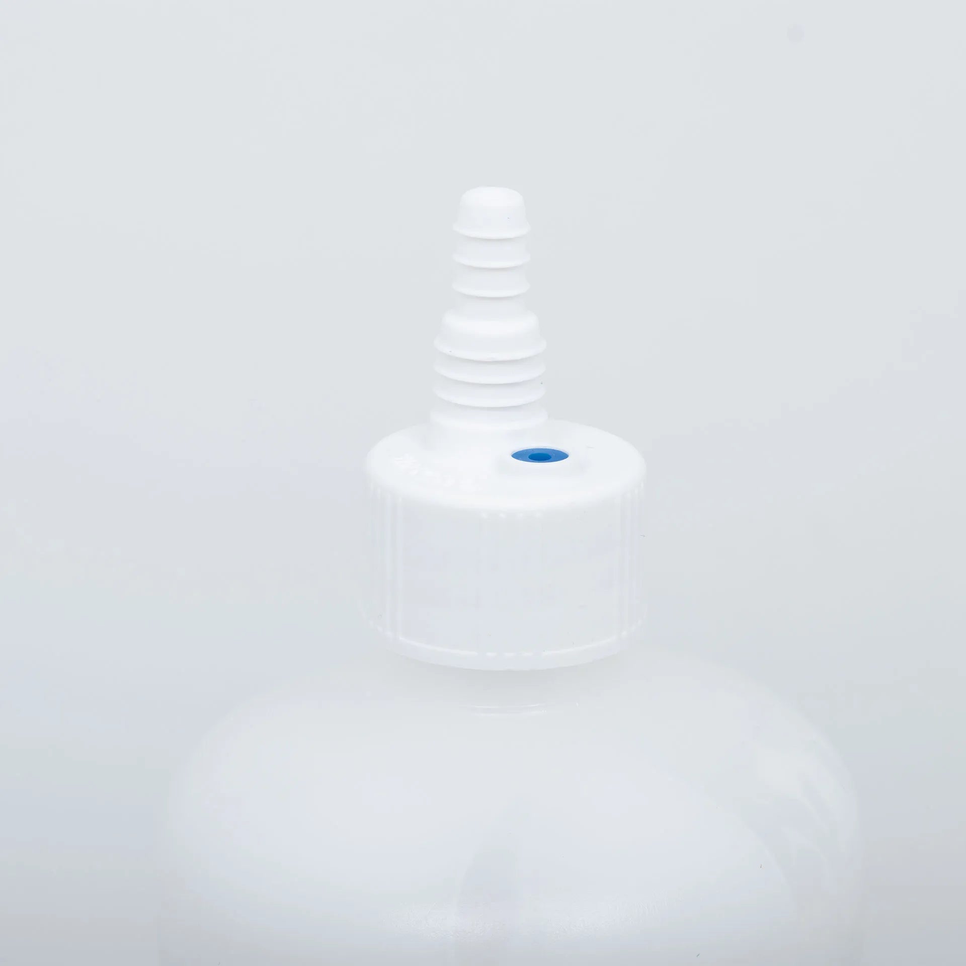 Synanthic® (oxfendazole oral suspension),"White bottle cap with attached dosing nozzle"