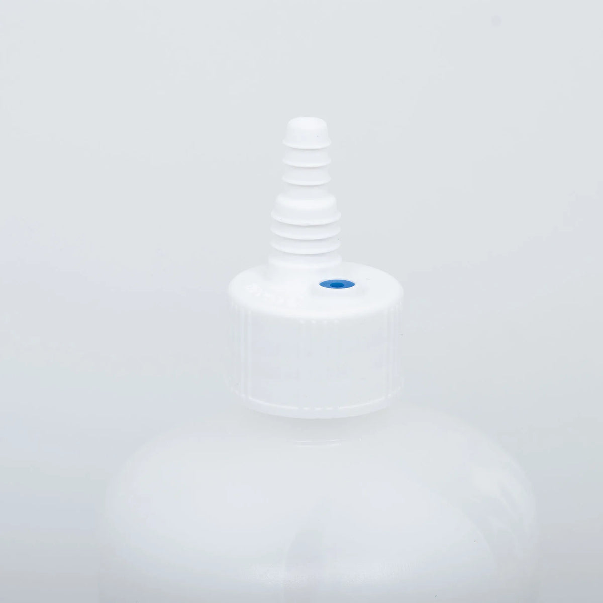 Synanthic® (oxfendazole oral suspension),"White bottle cap with attached dosing nozzle"