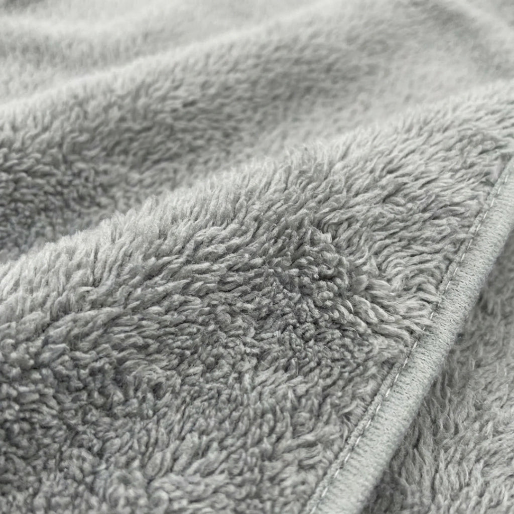 Puppywarmer Fleece Inserts,"Gray fleece fabric close-up with stitched edge"