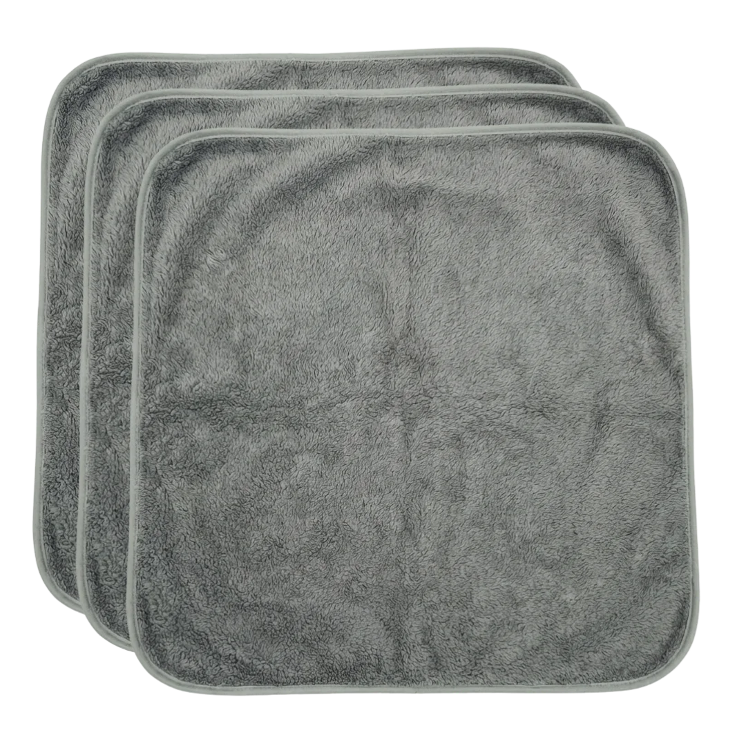 Puppywarmer Bundles,"Stack of three gray plush square pads"