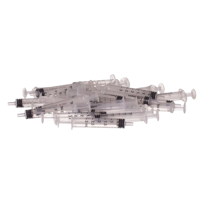 Small Syringes without Needles,"Pile of clear 3 mL syringes without needles"