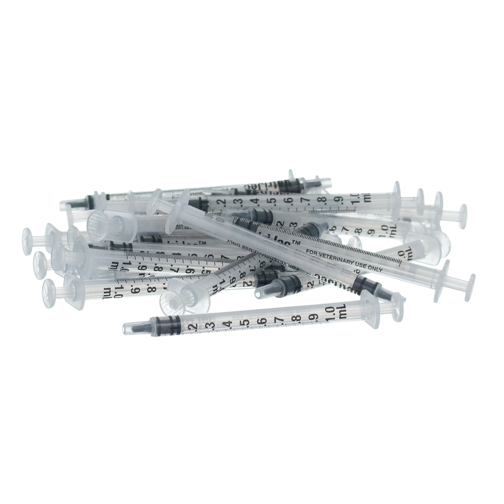 Small Syringes without Needles,"Pile of clear small syringes without needles"