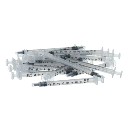 Small Syringes without Needles,"Pile of clear small syringes without needles"