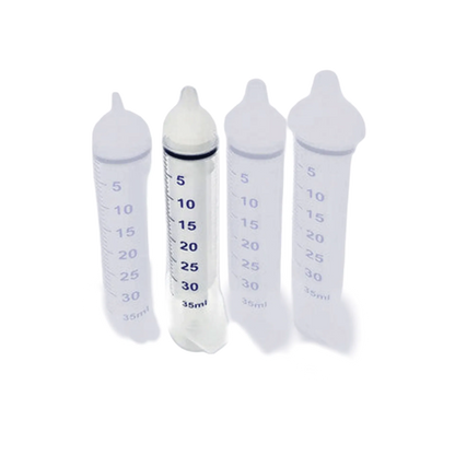 Puppywamer Latchons Syringe Nipple Feeders,"Four feeding syringes with white rubber nipple tips"