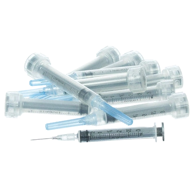3cc MonoJect™ Syringes with 22 gauge Needles,"Pile of clear syringes with blue needle caps"